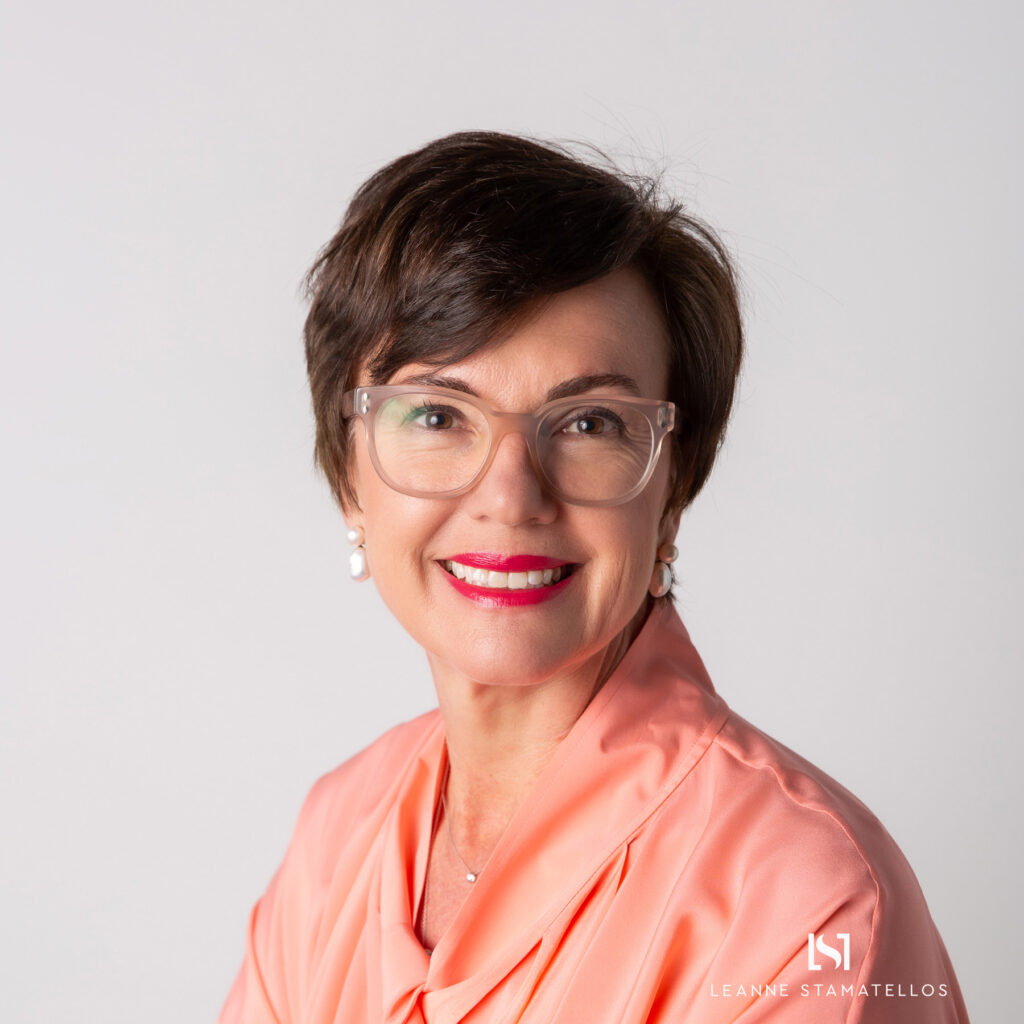 headshot of a lady wearing glasses