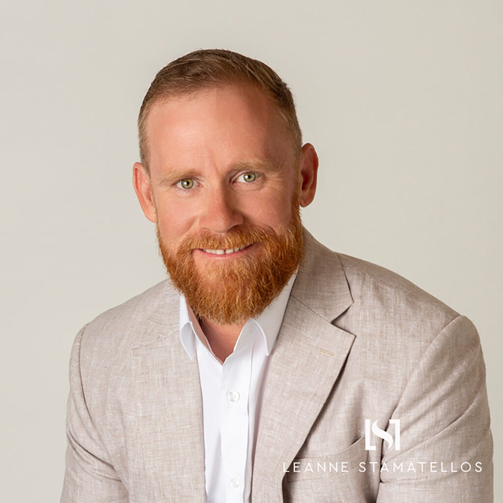 headshot of a red haired man